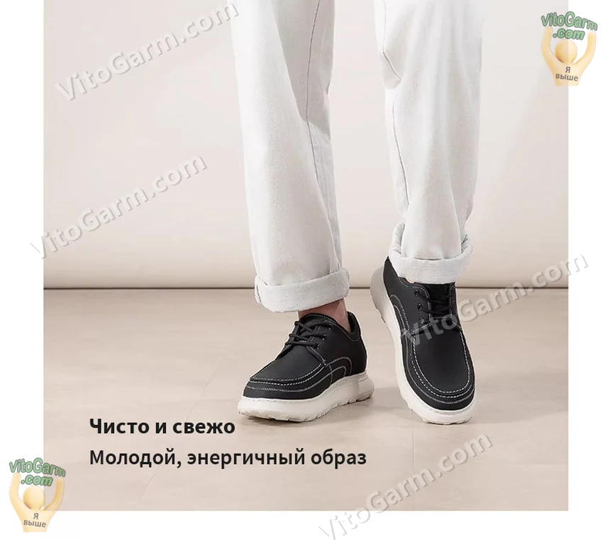 Чёрные туфли на ноге, вид спереди