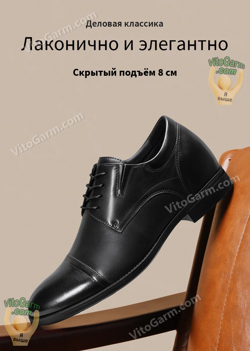 Чёрная деловая туфля с прямым мысом на подлокотнике кресла